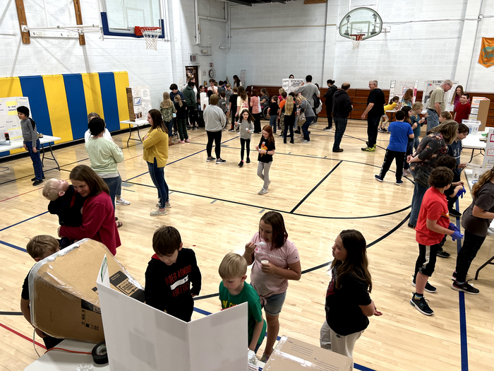 5th grade students presenting their science fair projects to family members and the community!